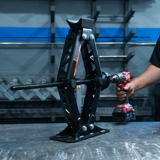 Scissor Jack HD on a table being raise with a 18v drill and included drill adapter hex